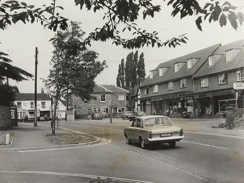 A classic saloon car drives past a row of parade shops - complete with an off-licence and a fish and chip shop - in the heart of Codsall on July 8, 1970. In the background across the road sits The Crown Inn, nestled alongside traditional brick homes, leafy trees, and a classic red telephone box. Despite a surge of new housing developments across South Staffordshire around this time, Codsall retained much of its quintessential village character, having placed third in its class in the Best Kept Village competition in 1968 and aiming for top honours again in 1970. Do you remember visiting the shops or stopping at The Crown Inn in Codsall back in the 1970s? How has the village changed or stayed the same since those summer days?