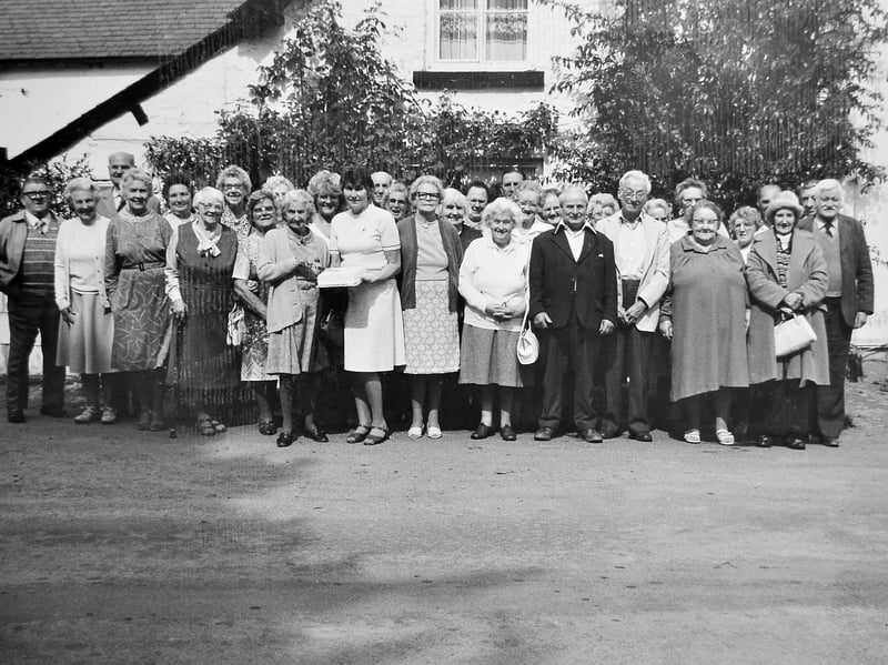 In September 1985, members of the Bishop's Castle WRVS Luncheon Club gathered together to mark a very special milestone as they celebrated their first anniversary. To mark the occasion, the group enjoyed a delicious special lunch cooked by Mrs O Cund, topped off with a homemade first birthday cake showcased proudly in the centre of the group shot. Do you recognise anyone in this celebratory group portrait from 1985?