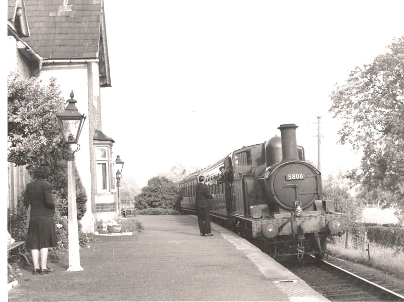 The photo is of ex GWR 0-4-2 locomotive No. 5806 pulling in to Llansantffraid Station on the Llanfyllin branch, circa 1955. No. 5806, an Oswestry engine, had a fairly long association with the branch, being sub-shedded at Llanfyllin until that shed closed in 1952. The engine was withdrawn from Oswestry in June 1957.