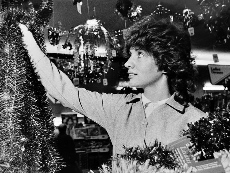 Christmas begins to arrive in Oswestry. Sales assistant Helen Wilkinson adds the finishing touches to a festive display at Woolworths in November 1982, as shops prepared for the busy Christmas shopping season. Do you remember Christmas displays in Woolworths?