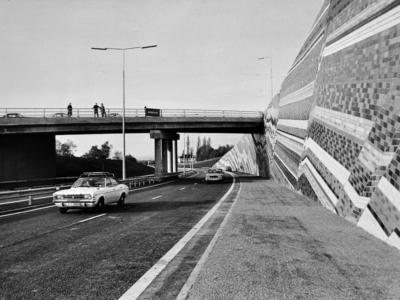 November 1981: vehicles pass under Stafford Road bridge as the North Eastern Primary Road (South) opens, completing part of Telford’s Queensway link. A Ford Cortina is seen in the foreground.