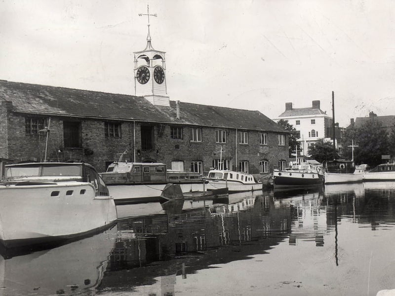 Pleasure craft and cabin cruisers rest peacefully in the calm waters of one of the famous canal basins at Stourport on Severn in August 1962. Often affectionately dubbed the Little Venice of the Midlands, the town grew around the junction of the Staffordshire and Worcestershire Canal and the River Severn, turning it into a thriving inland port. Overlooked by the historic clock tower and surrounding warehouses, this tranquil summer scene captures the era when the historic basins were transitioning from busy commercial transport hubs into popular leisure destinations. Do you remember taking trips out on the water or visiting the canal basins at Stourport in the 1960s?