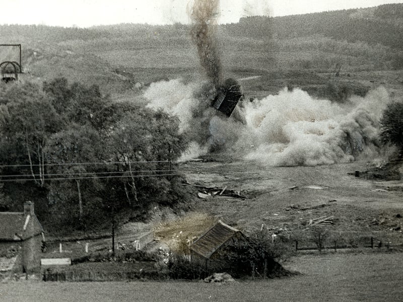 Plumes of dust and debris fill the air as a huge 130ft chimney comes crashing down during the clearance of Brereton Colliery in 1962. Men from 213 Field Squadron, drawn from Cannock and Stafford, carried out the extensive preparation work prior to the controlled demolition. The squad was also tasked with disposing of most of the disused pit's remaining surface installations, bringing a dramatic close to centuries of mining history at the site. Do you remember the day the old chimney came down, or did you know anyone who worked at Brereton Colliery?