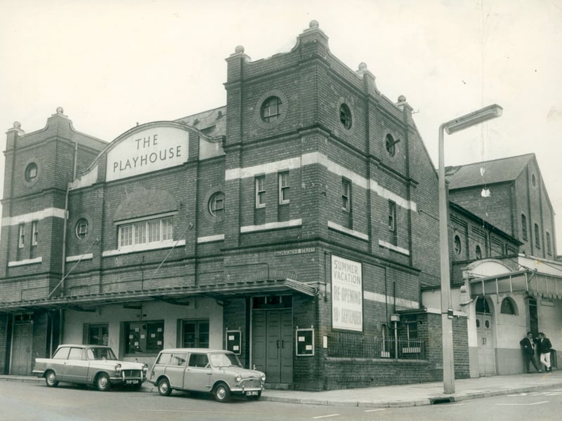 A classic Mini Traveller and saloon car are parked along the street outside the newly refurbished Kidderminster Playhouse in August 1962. Situated on the corner of Comberton Hill and Bromsgrove Street, the popular theatre venue had just undergone a major refresh ahead of its upcoming autumn season, as advertised on the "Summer Vacation" posters outside. Run largely as a community enterprise, the venue hosted decades of amateur dramatics, touring stage shows, and musical performances, making it a beloved focal point for local culture. Did you ever see a show or perform on stage at the Kidderminster Playhouse back in the 1960s?