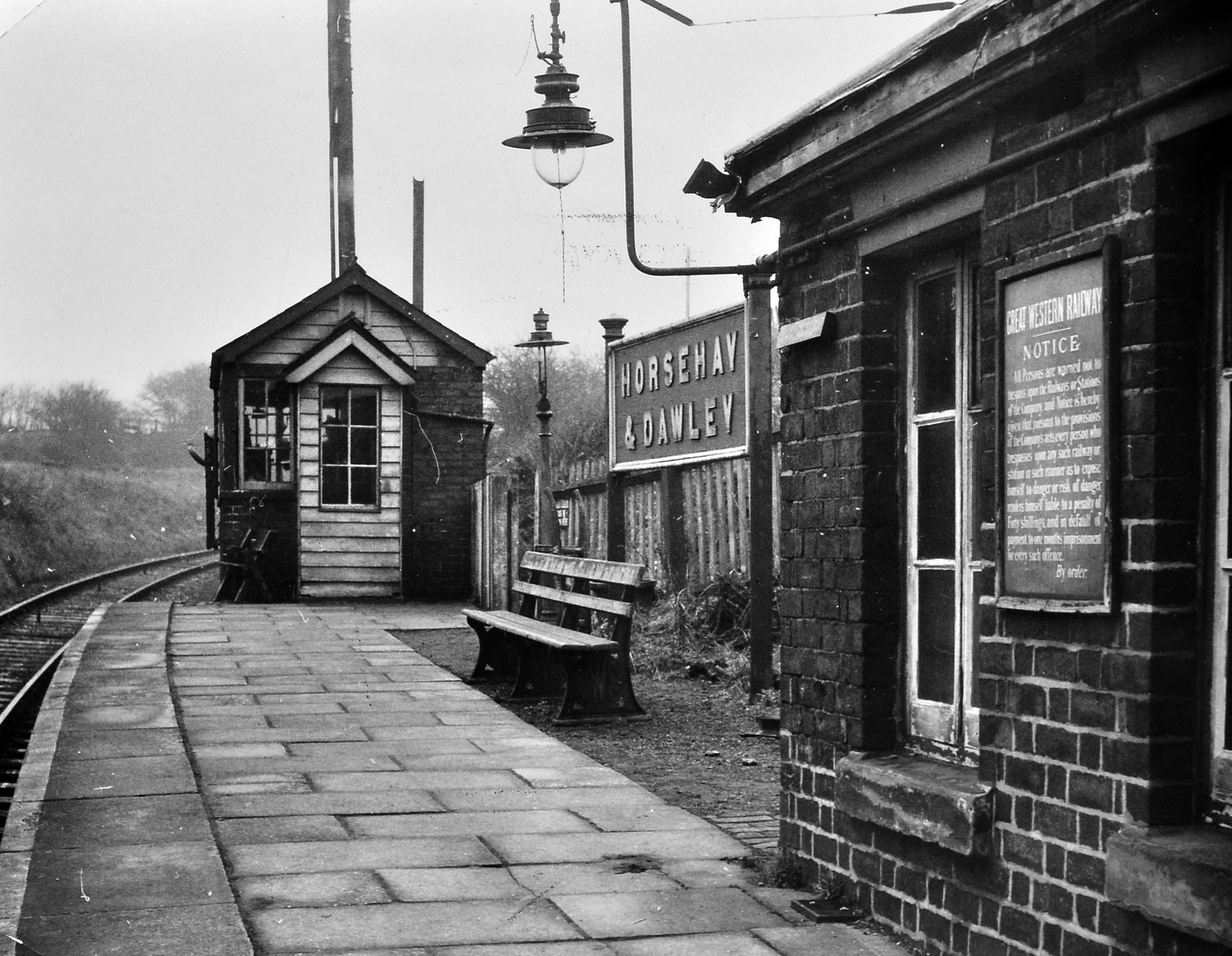 A quiet scene at Horsehay and Dawley railway station is captured on February 21, 1962, just before the station closed. With little sign of the bustle that once surrounded the railway, the photograph feels like a moment caught just before the end of an era. Can you remember travelling from this station? What do you remember about Horsehay and Dawley before the railway disappeared?