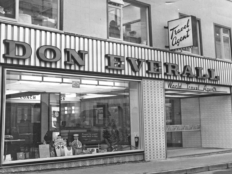 The smart, modern shopfront of Don Everall World Travel Agents welcomes holidaymakers in Wolverhampton in November 1962. A household name across the West Midlands, the business was famous for its vast fleet of red and cream coaches, day trips, and package holidays. The large picture window displays advertisements for ocean cruises and coach travel, showcasing a time when booking a getaway meant a trip into town to chat with your local agent in person. Do you remember booking a coach trip or a family holiday at Don Everall back in the 1960s?
