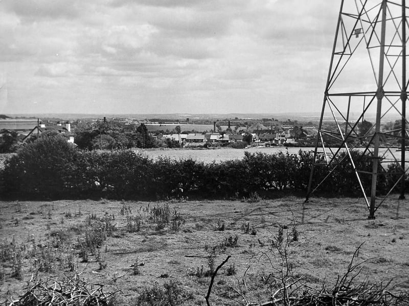 Little Wenlock and Coalmoor are pictured in a sweeping panorama from around 1962, looking towards Horsehay and Dawley. In the distance, the tower of Dawley church appears to rise above the landscape, while an electricity pylon stands prominently in the foreground. Much of the view would change dramatically in the years that followed as Telford began to take shape. How much of this landscape can you recognise today? Can you spot any other familiar landmarks?