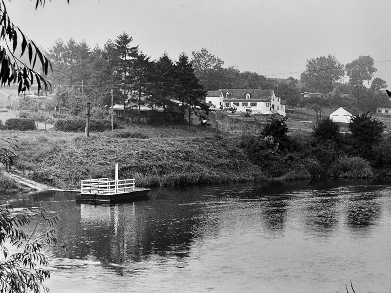 A peaceful moment at Hampton Loade. The ferry crosses the River Severn in August 1982, offering a glimpse of a slower pace of life. Do you remember using the ferry?
