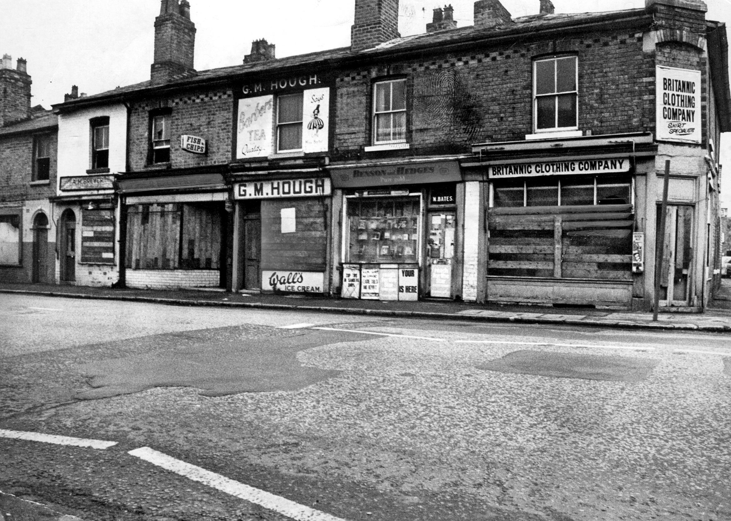 A group of derelict shops stood on Stafford Road in February 1975, opposite Ewins Street and between Moseley Street and the GWR works. The empty buildings give an impression of an area in transition, with demolition and redevelopment changing the streets around them. Can you remember these shops, or what this stretch of Stafford Road looked like before it changed?