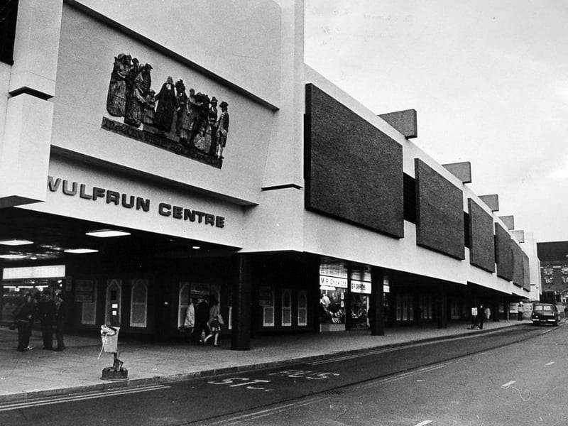 The striking modern facade of the Wulfrun Centre stretches along the street on October 8, 1969, featuring bold architectural panels and the prominent sculpture depicting local historical figures above the entrance. Built as part of a major post-war redevelopment drive, the shopping precinct transformed town centre retail by offering covered walkways and unit spaces for popular high street stores. The site quickly became a central hub for everyday shoppers and families in Wolverhampton throughout the late 1960s and beyond. Do you remember shopping under the distinctive sculpture at the Wulfrun Centre entrance back in 1969?