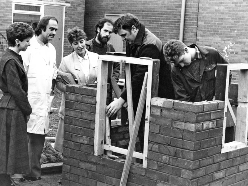 Staffordshire trainees Malcolm Evans and Neil Cooper demonstrate their bricklaying skills during an open day at the Cannock unit of Staffordshire County Council's training division in December 1989. Visitors to the Hawks Green Industrial Estate centre were able to watch the young men at work as they trained for careers in the building trade. Do you remember learning a trade through a local training scheme?