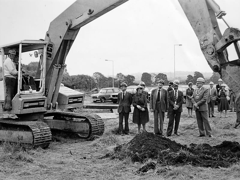 The first steps towards Telford's Princess Royal Hospital. Frank Jones takes the controls to lift the first turf as work begins on the town's long-awaited new hospital in July 1982. Among those watching are Wellington councillors Ray Hall and Ernie Griffiths, along with Wrekin Council chairman Cliff Briggs. Do you remember the hospital being built?