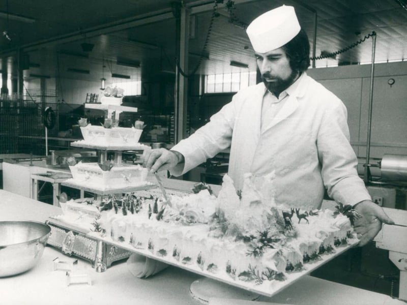 Chef Gordon Sergeant puts the finishing touches to one of the many Christmas cakes being made at Firkins bakery in West Bromwich in December 1975. The photograph captures the busy preparations for Christmas, when much of the baking was still done by hand in local bakeries. Do you remember buying your Christmas cake from a local bakery, or the sights and smells of the shops in the run-up to Christmas?