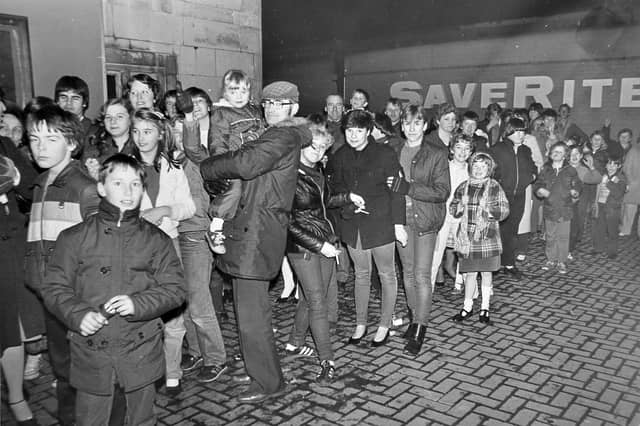 When ET landed in Wellington. Excited cinema-goers queue outside the Clifton on opening night in December 1982, with Saverite visible in the background. What was the first film you remember seeing there?