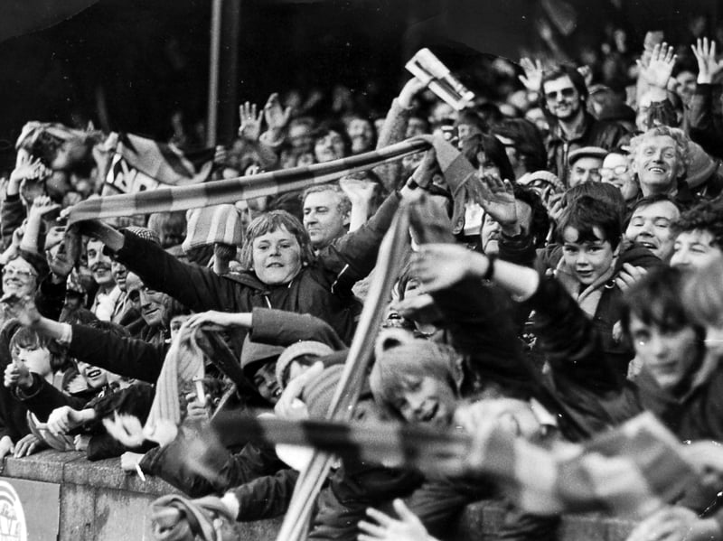 Arms stretch high and blue-and-amber scarves flutter above the railway end terraces on May 17, 1979, as thousands of ecstatic Shrewsbury Town supporters celebrate sealing historic promotion to the old Second Division beneath the Gay Meadow floodlights. Can you spot your own younger self or a mate amongst the sea of scarves and smiles that evening? How long did the celebrations carry on through the streets of Shrewsbury after the final whistle blew?