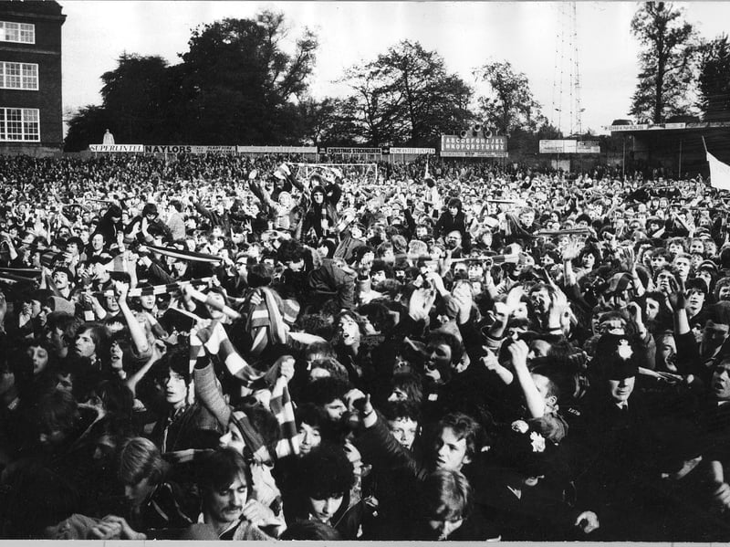 A sea of jubilant supporters surges across the Gay Meadow grass in May 1979 as the final whistle confirms an emphatic four-one victory over Exeter City, crowning Graham Turner’s side champions of the Third Division. Were you one of the thousands who spilled over the barriers and onto the pitch at full-time? Did you manage to get near the players to celebrate before they were carried off down the tunnel?