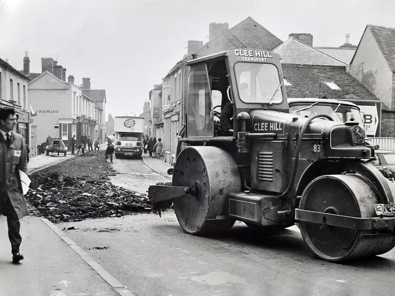Dawley High Street was undergoing a facelift in April 1967 as resurfacing works transformed one of the town's busiest roads. While the disruption sparked plenty of debate at the time, the scene now offers a fascinating snapshot of a town adapting to change. Do you remember the roadworks, the shops that lined the High Street, or how Dawley looked before the arrival of Telford New Town?