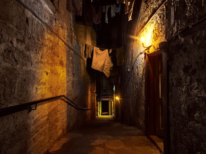 Hidden beneath Edinburgh’s Royal Mile, the Real Mary King’s Close preserves the story of the city’s former streets, now underground, where residents endured the devastating plague outbreak of 1645. Its most famous ghost is Annie, a young girl said to have died during the plague and to haunt a small room after losing her favourite doll. Since a reported psychic encounter in 1992, visitors have left toys and gifts for Annie, while some claim to experience sudden cold spots or feel a small hand tugging at their clothes.