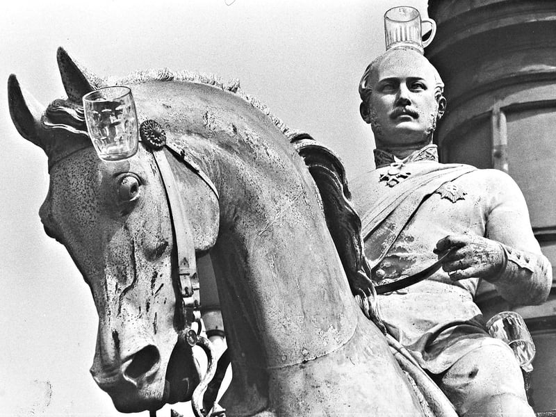 Queen Victoria would definitely not have been amused! Cheeky late-night revellers gave the iconic statue of Prince Albert in Queen Square a hilarious makeover by balancing beer glasses atop the Prince's head, his horse's ear, and near his side in August 1976. It was the second time in recent months that the grand 110-year-old monument became an impromptu target for banter, following a previous prank where pranksters jammed a litter bin over the Prince's head. The cheeky stunt certainly gave shoppers across Wolverhampton a playful laugh as they passed through the square.