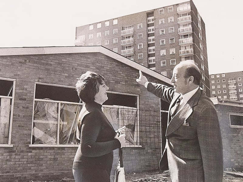 Tenants' association secretary Mrs Jan Turner and association president Councillor Geoff Dalton survey the near-complete construction of a purpose-built club at Bolton Court, Ocker Hill, in April 1976. Set beneath the towering residential flats and scheduled to open by mid-June, the new facility—complete with a large assembly room—was built to accommodate more than 180 members with a full calendar of social functions, live shows, and dances. Did you live at Bolton Court or attend any of the community dances and shows held at the tenants' club in Tipton during the 1970s?