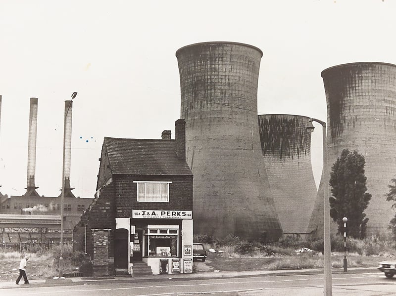 The solitary premises of J & A Perks newsagents and tobacconists at 154 Leabrook Road stands dwarf-like beneath the looming cooling towers of Ocker Hill power station in July 1976. Following the clearance and demolition of neighbouring homes along the road, the resilient little shop found itself isolated on the roadside ahead of planned industrial redevelopment and widening works along Leabrook Road. Do you remember popping into J & A Perks for your daily paper or seeing this dramatic industrial silhouette back in the long, hot summer of 1976?