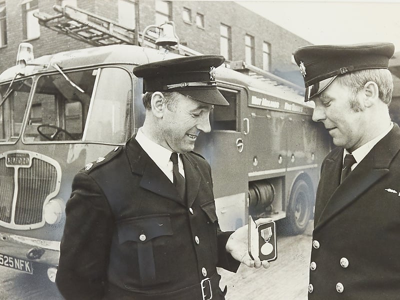 Station Officer Mick Ryan (left) and Sub-Officer Sam Elsdon (right) proudly admire their newly presented long service and good conduct medals in front of their appliance in February 1976. Based at Smethwick fire station, both men had completed nearly 22 years of steadfast service keeping the local community safe, with their prestigious honours officially bestowed at West Midlands County Council headquarters in Birmingham. Do you remember Mick Ryan or Sam Elsdon, or did you have family serving in the local fire brigades across the region during the 1970s?
