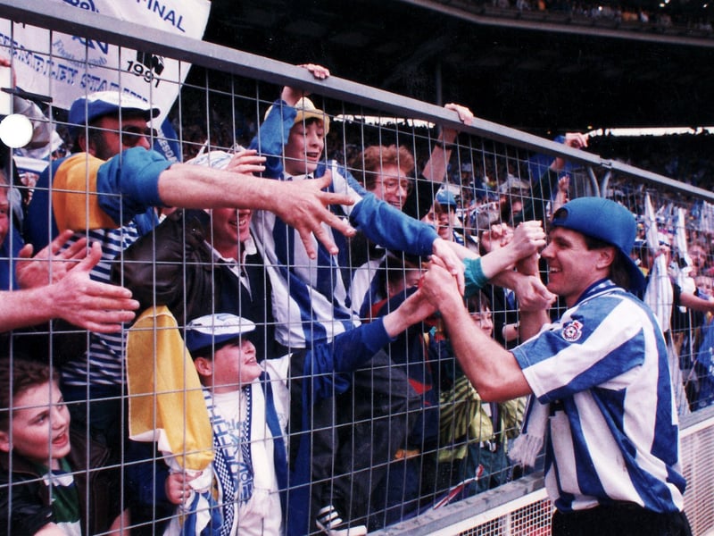 Sheffield Wednesday fans and players celebrate the club's 1-0 victory over Manchester United at Wembley in the Rumbelows League Cup Final in April 1991. Wednesday went on to win promotion at the end of the season 1990/91, making it a double celebration.