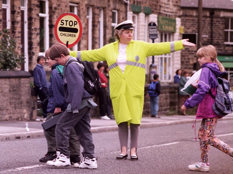 Lollipop lady Pamela Gascoyne pictured helping children across the busy road at Crosspool, Sheffield, in September 1996