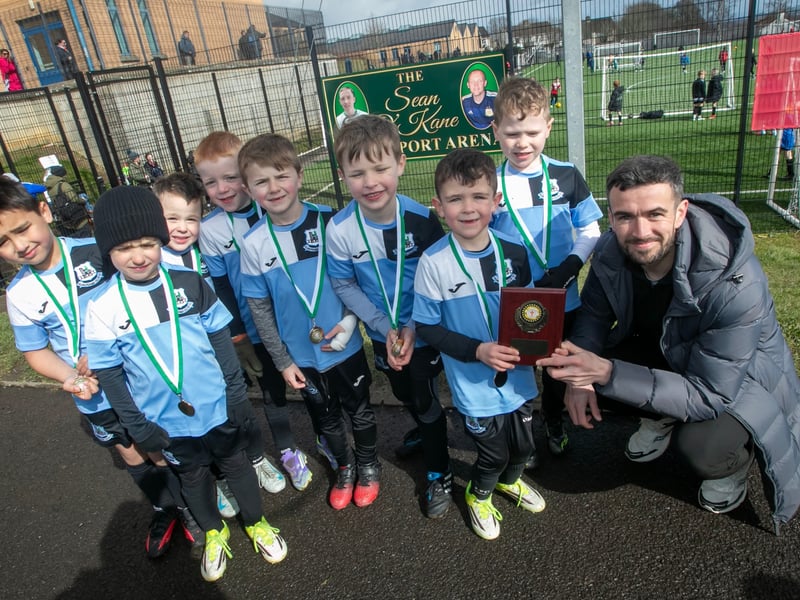 Derry City star Michael Duffy presenting the 2019s Shield to Kilmacrennan Celtic FC.