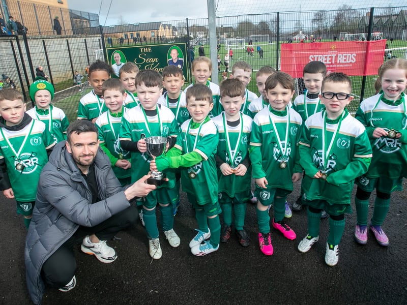 Derry City star Michael Duffy presenting the 2019s Cup to Foyle Harps FC at Saturday's Sean O'Kane Memorial Tournament in St. Joseph's Boys School. (Photos: Jim McCafferty Photography)