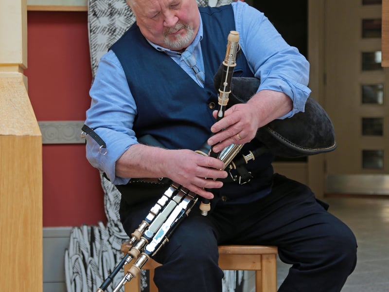 Caption: Noel Carberry on th Uilleann Pipes at Corlea Trackway Centre