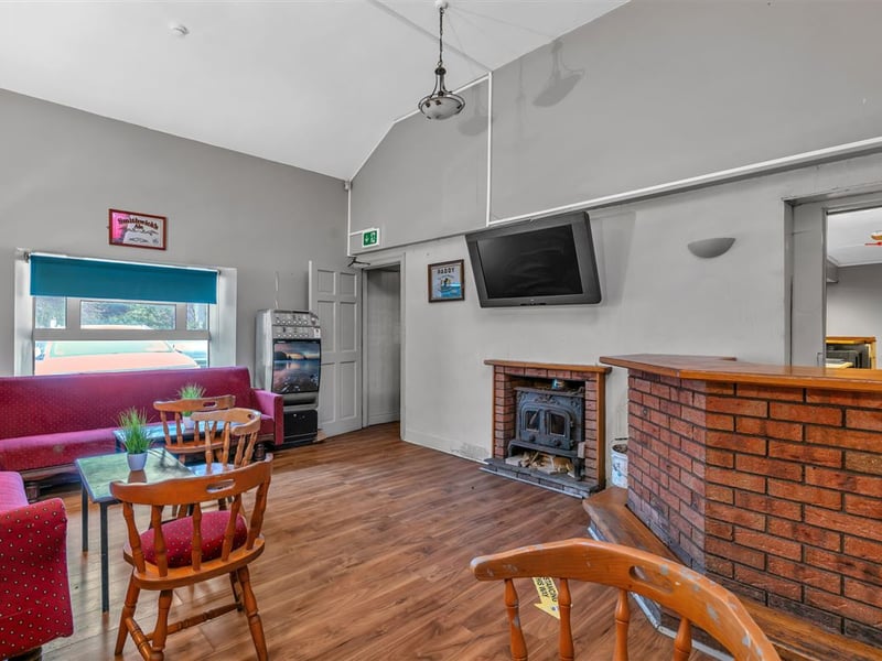 The Railway Yard Inn in Moneenroe, near Castlecomer, County Kilkenny, has been listed for sale on Daft.ie, offering buyers the chance to take on a well-known rural pub along with living accommodation and a substantial outdoor area. The property includes a fully fitted bar and lounge area along with a private residence, making it a potential lifestyle business for anyone looking to run a traditional Irish pub. Set on roughly two acres of land with frontage onto two roads, the site also features a large yard and additional outdoor space, which could offer further development potential subject to planning permission. TAP NEXT FOR NEXT PIC Inside, the pub retains plenty of traditional character, with a cosy bar area that has served locals and visitors alike over the years. READ NEXT: Proud Kilkenny man to star in new series of The Great House Revival on RTE The attached residence provides private accommodation for owners, making it an attractive option for buyers seeking both a home and business opportunity in a rural Kilkenny setting. Located in Moneenroe, just outside Castlecomer, the pub sits in a scenic part of the county that is popular with locals and visitors exploring the surrounding countryside. READ NEXT: FEATURE: Kilkenny parishioners pull together to save their local pub The guide price for the property is €398,950. CLICK HERE FOR MORE LOCAL PROPERTY STORIES
