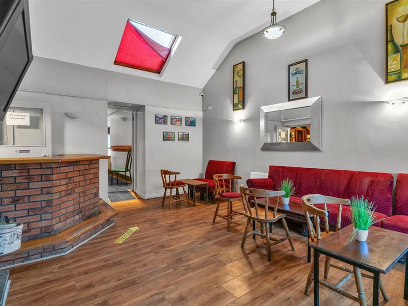 The Railway Yard Inn in Moneenroe, near Castlecomer, County Kilkenny, has been listed for sale on Daft.ie, offering buyers the chance to take on a well-known rural pub along with living accommodation and a substantial outdoor area. The property includes a fully fitted bar and lounge area along with a private residence, making it a potential lifestyle business for anyone looking to run a traditional Irish pub. Set on roughly two acres of land with frontage onto two roads, the site also features a large yard and additional outdoor space, which could offer further development potential subject to planning permission. TAP NEXT FOR NEXT PIC Inside, the pub retains plenty of traditional character, with a cosy bar area that has served locals and visitors alike over the years. READ NEXT: Proud Kilkenny man to star in new series of The Great House Revival on RTE The attached residence provides private accommodation for owners, making it an attractive option for buyers seeking both a home and business opportunity in a rural Kilkenny setting. Located in Moneenroe, just outside Castlecomer, the pub sits in a scenic part of the county that is popular with locals and visitors exploring the surrounding countryside. READ NEXT: FEATURE: Kilkenny parishioners pull together to save their local pub The guide price for the property is €398,950. CLICK HERE FOR MORE LOCAL PROPERTY STORIES