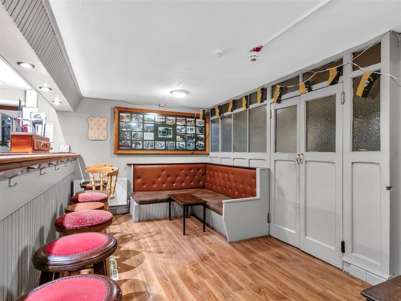 The Railway Yard Inn in Moneenroe, near Castlecomer, County Kilkenny, has been listed for sale on Daft.ie, offering buyers the chance to take on a well-known rural pub along with living accommodation and a substantial outdoor area. The property includes a fully fitted bar and lounge area along with a private residence, making it a potential lifestyle business for anyone looking to run a traditional Irish pub. Set on roughly two acres of land with frontage onto two roads, the site also features a large yard and additional outdoor space, which could offer further development potential subject to planning permission. TAP NEXT FOR NEXT PIC Inside, the pub retains plenty of traditional character, with a cosy bar area that has served locals and visitors alike over the years. READ NEXT: Proud Kilkenny man to star in new series of The Great House Revival on RTE The attached residence provides private accommodation for owners, making it an attractive option for buyers seeking both a home and business opportunity in a rural Kilkenny setting. Located in Moneenroe, just outside Castlecomer, the pub sits in a scenic part of the county that is popular with locals and visitors exploring the surrounding countryside. READ NEXT: FEATURE: Kilkenny parishioners pull together to save their local pub The guide price for the property is €398,950. CLICK HERE FOR MORE LOCAL PROPERTY STORIES