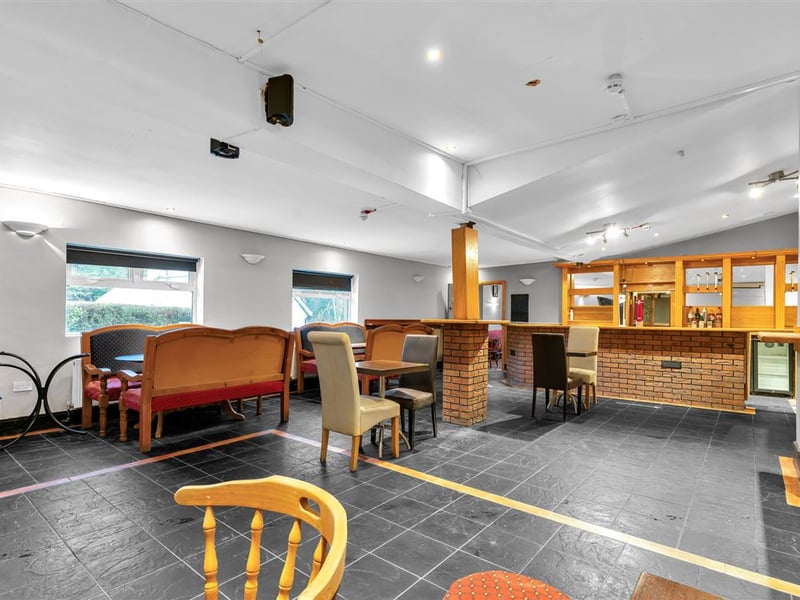 The Railway Yard Inn in Moneenroe, near Castlecomer, County Kilkenny, has been listed for sale on Daft.ie, offering buyers the chance to take on a well-known rural pub along with living accommodation and a substantial outdoor area. The property includes a fully fitted bar and lounge area along with a private residence, making it a potential lifestyle business for anyone looking to run a traditional Irish pub. Set on roughly two acres of land with frontage onto two roads, the site also features a large yard and additional outdoor space, which could offer further development potential subject to planning permission. TAP NEXT FOR NEXT PIC Inside, the pub retains plenty of traditional character, with a cosy bar area that has served locals and visitors alike over the years. READ NEXT: Proud Kilkenny man to star in new series of The Great House Revival on RTE The attached residence provides private accommodation for owners, making it an attractive option for buyers seeking both a home and business opportunity in a rural Kilkenny setting. Located in Moneenroe, just outside Castlecomer, the pub sits in a scenic part of the county that is popular with locals and visitors exploring the surrounding countryside. READ NEXT: FEATURE: Kilkenny parishioners pull together to save their local pub The guide price for the property is €398,950. CLICK HERE FOR MORE LOCAL PROPERTY STORIES