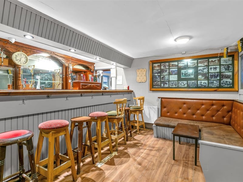 The Railway Yard Inn in Moneenroe, near Castlecomer, County Kilkenny, has been listed for sale on Daft.ie, offering buyers the chance to take on a well-known rural pub along with living accommodation and a substantial outdoor area. The property includes a fully fitted bar and lounge area along with a private residence, making it a potential lifestyle business for anyone looking to run a traditional Irish pub. Set on roughly two acres of land with frontage onto two roads, the site also features a large yard and additional outdoor space, which could offer further development potential subject to planning permission. TAP NEXT FOR NEXT PIC Inside, the pub retains plenty of traditional character, with a cosy bar area that has served locals and visitors alike over the years. READ NEXT: Proud Kilkenny man to star in new series of The Great House Revival on RTE The attached residence provides private accommodation for owners, making it an attractive option for buyers seeking both a home and business opportunity in a rural Kilkenny setting. Located in Moneenroe, just outside Castlecomer, the pub sits in a scenic part of the county that is popular with locals and visitors exploring the surrounding countryside. READ NEXT: FEATURE: Kilkenny parishioners pull together to save their local pub The guide price for the property is €398,950. CLICK HERE FOR MORE LOCAL PROPERTY STORIES