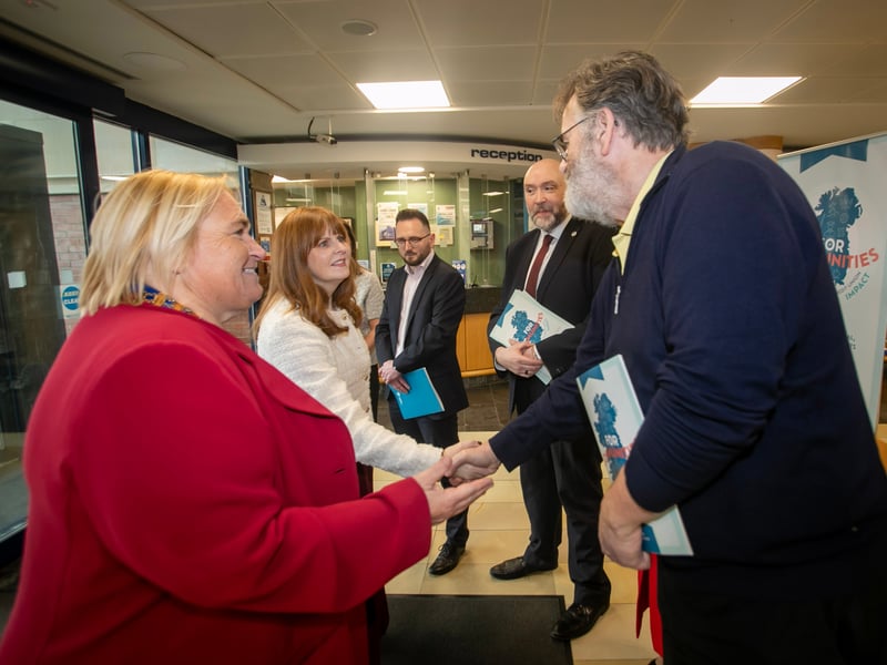 Minister for the Economy Dr. Caoimhe Archibald being introduced to Sean Hegarty, Acting CEO, Derry Credit Union during Thursday's visit.