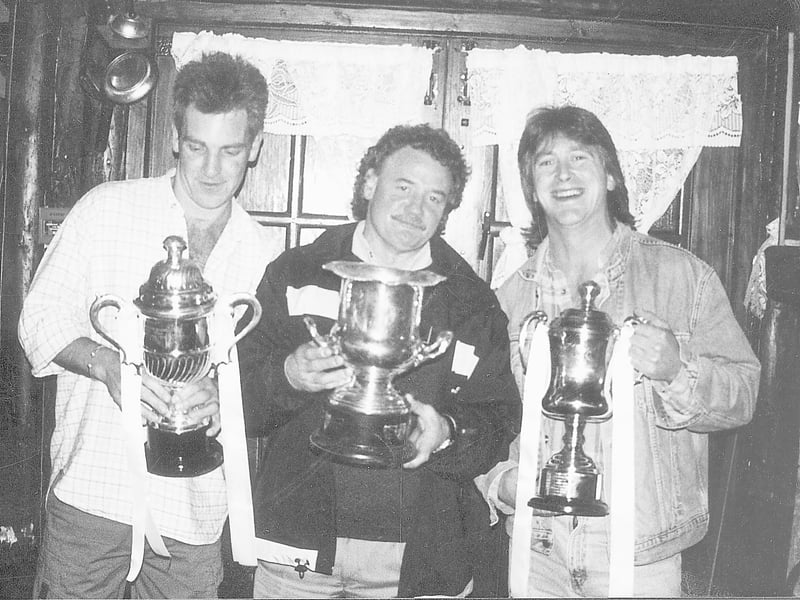 Caption: 2001 Valentine's team celebrate treble triumph - John Locke, team captain; Pat 'Zac' Hackett, former Town player and manager and Brian Lyons, team manager proudly display the three trophies – the Mitten Cup, the Subsidiary Cup and the Watkins Cup