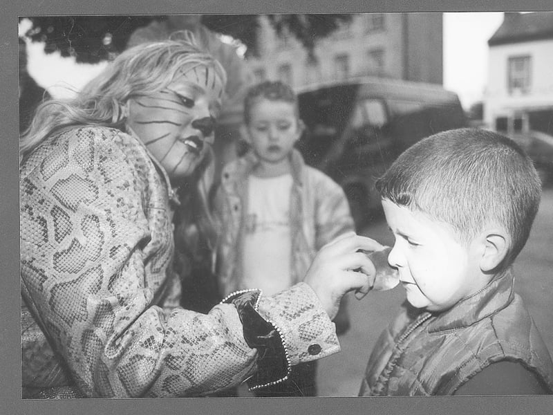 Caption: Ballymahon Summer Festival 2001 - Barry John Walsh having his painted by Shannon Thompson
