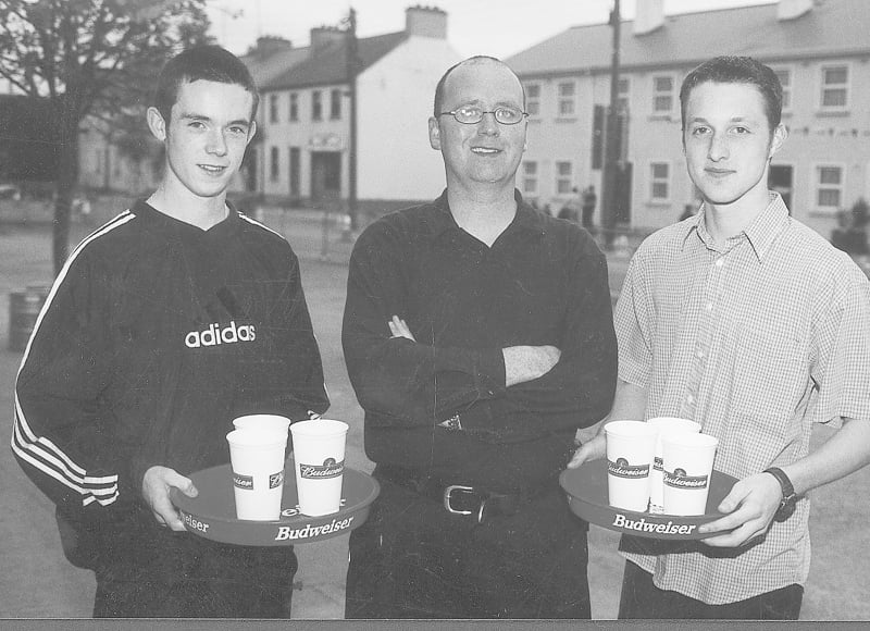Caption: Ballymahon Summer Festival 2001 - Winners in the Barman's race James Kenny and Simon Keegan with organiser Michael Conlon