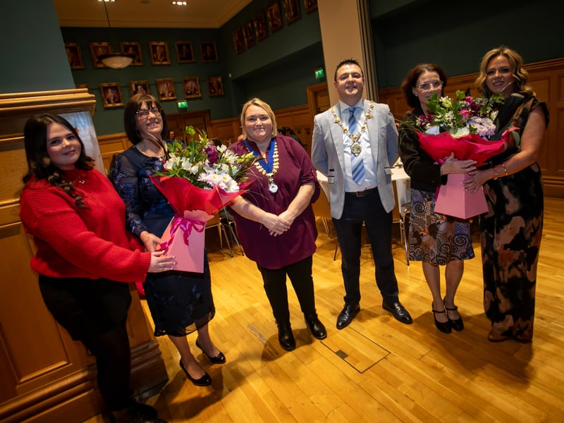 The two ladies receiving bouquets of flowers at Tuesday's Mayoral Reception in the Guildhall, Derry.