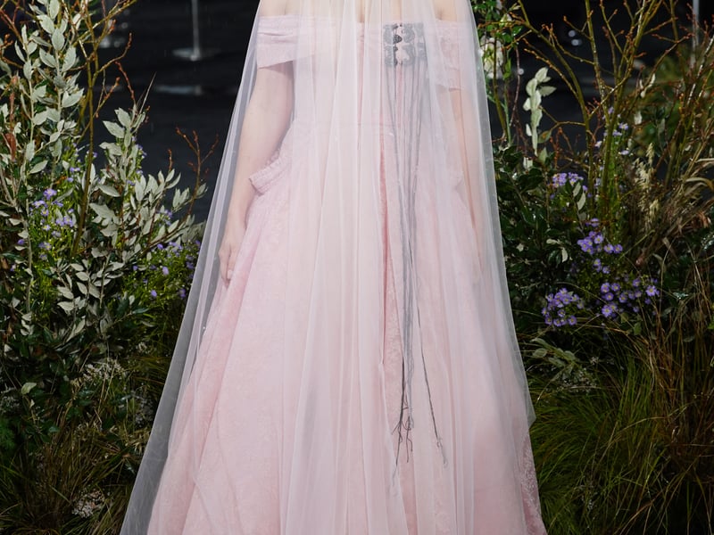 Charli XCX, 33, who wrote the score for the film, followed suit in Gothic glamour wearing a floor-length veil and off the shoulder pink tulle and lace dress by London-based designer Erdem.