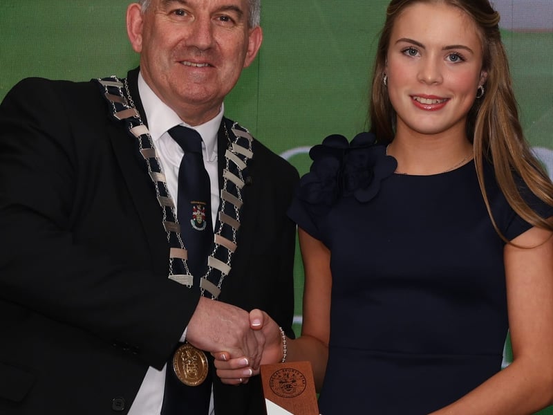 PRIMARY SCHOOL SPORTS GIRL The winner of the Primary School Sports Girl Award is Caoimhe McNeill, Dooish National School Caoimhe has represented her school with distinction across Gaelic football, soccer, basketball, Sportshall athletics, track and field, and cross-country. In team sports, she played a key role in helping Dooish N.S. reach the FAI 5-a-side county final, top their group in the FAI 7-a-side competition, and advance to the Cumann na mBunscoil Gaelic football county final. In athletics, Caoimhe enjoyed an outstanding year. She won individual gold at the Finn Valley Cross Country event in September ‘24, leading her school to team victory. She followed this with strong performances in Sportshall, third place in the 100 metres, and first place in the 800 metres at regional level. The highlight came at the Primary Schools County Sports, where she claimed gold in the 800 metres and was later awarded the prestigious John Carlin Award for outstanding performance, selected from nearly 4,000 competitors. This is Caoimhe’s first Donegal Sports Star Award.