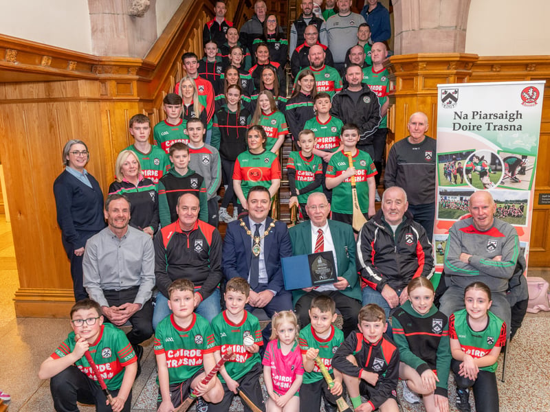 Doire Trasna GAC who are celebrating their 25th Anniversary received a commemorative crystal gift from the Mayor Councillor Ruairi McHugh in the Guildhall to mark their outstanding contribution to sport, community life and promotion of Gaelic games. During the evening the club’s traditional band and Irish dancers entertained guest with performances. The award was received by club President, Eddie Nash, pictured with seated from left, Mark O’Doherty, Chairperson, Paul Simpson, Brian McKenna and Paddy McNaught who are founding members of the Club. (Photos: Martin McKeown)