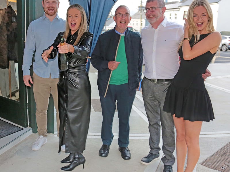 Caption: John Farrell, Marie Farrell popping the champagne to mark the opening of 'The Salon No. 1’, Fr Ber Hogan, John and Ciara Farrell