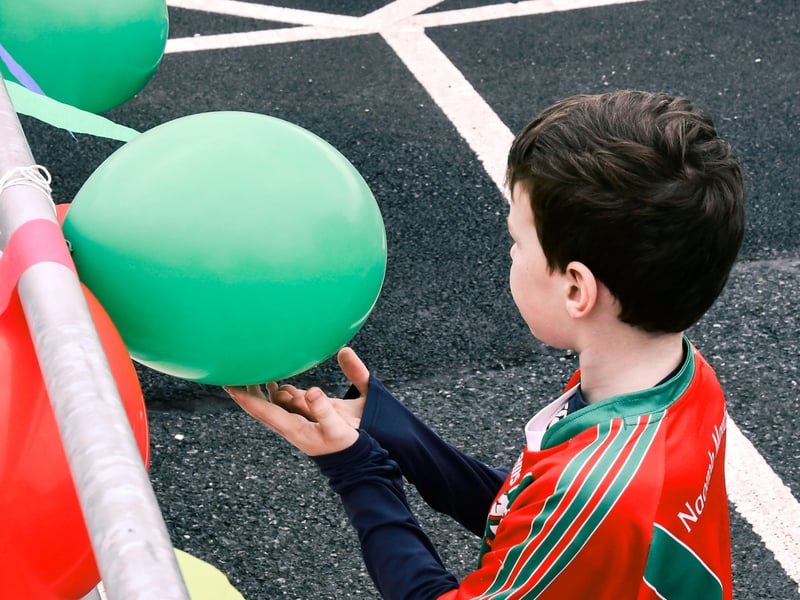 The young Mr. Hally checks that the balloons are correctly pressurised!PICTURE: HARRY REID