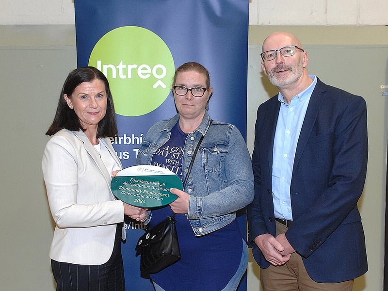 Below: Noeleen Mallon and Paul McArdle of the DSP scheme presenting a plaque to Francis Blackner of the Mount Oliver Scheme