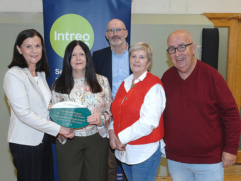 Below: Original members Mags Smith, Ellen Cassidy and Tubby Corrway receiving a plaque from Maureen Mallon and Paul McArdle of the DSP