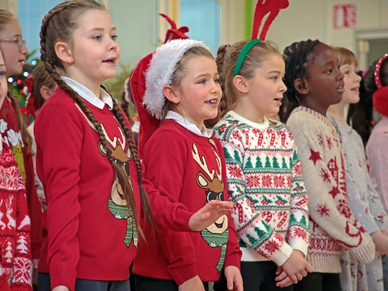 Caption: Students singing carols