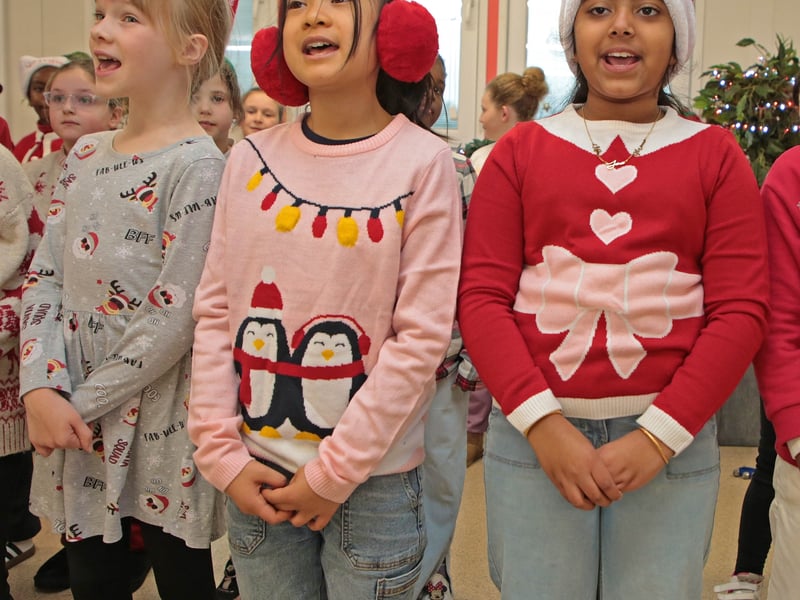 Caption: Students singing carols